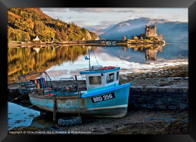 Eilean Donan Castle with the Saltire unfurled Framed Print by Chris Drabble
