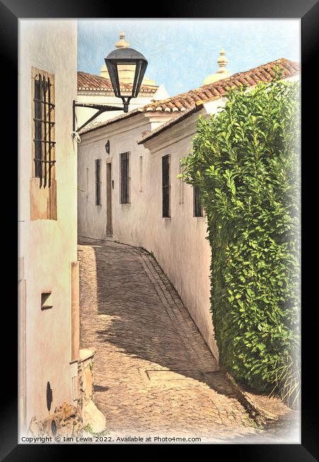 A Village Lane in Portugal Framed Print by Ian Lewis
