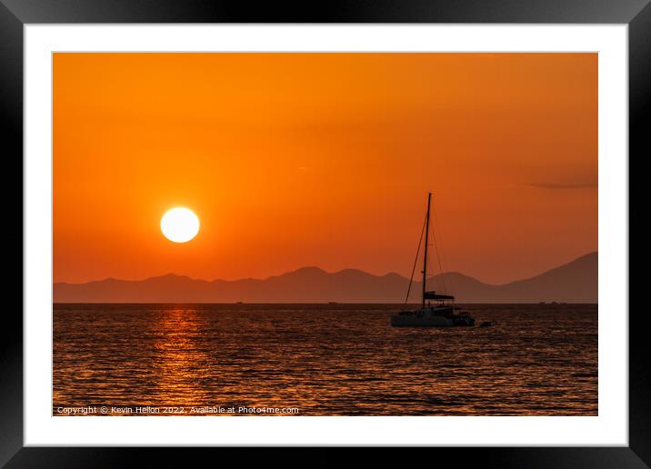 Catamaran moored in Krabi at sunset Framed Mounted Print by Kevin Hellon