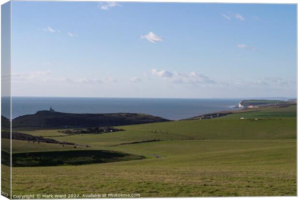 The rolling hills of Beachy Head and the Seven Sisters. Canvas Print by Mark Ward