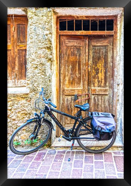 Bicycle and old doors Framed Print by Kevin Hellon