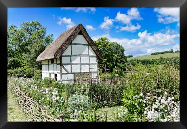 Enchanting Half-Timbered Cottage in a Blossoming G Framed Print by Roger Mechan