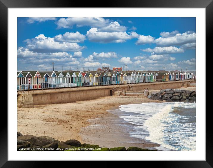 Lively Beach Huts by the Rocky Shore Framed Mounted Print by Roger Mechan