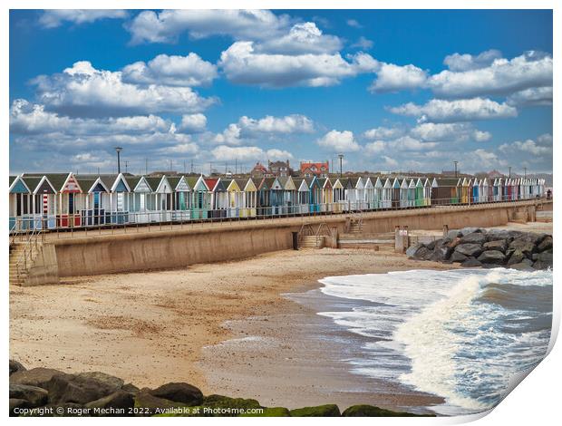Lively Beach Huts by the Rocky Shore Print by Roger Mechan
