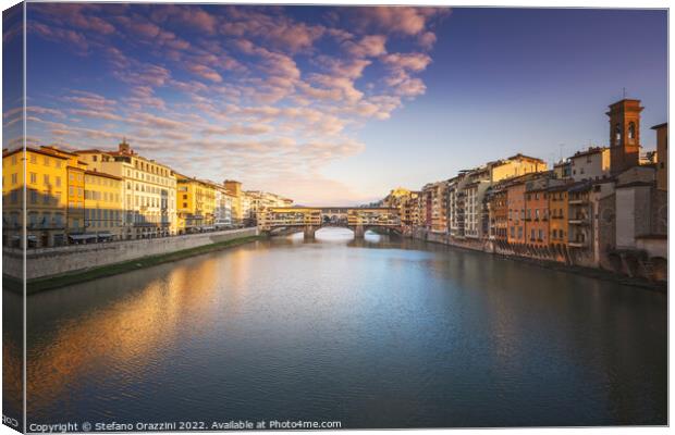 Ponte Vecchio bridge and Arno river in Florence at sunset. Canvas Print by Stefano Orazzini