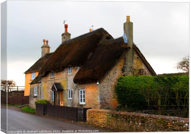 Thatched Cottage in Little Badminton, Cotswolds Canvas Print by Graham Lathbury