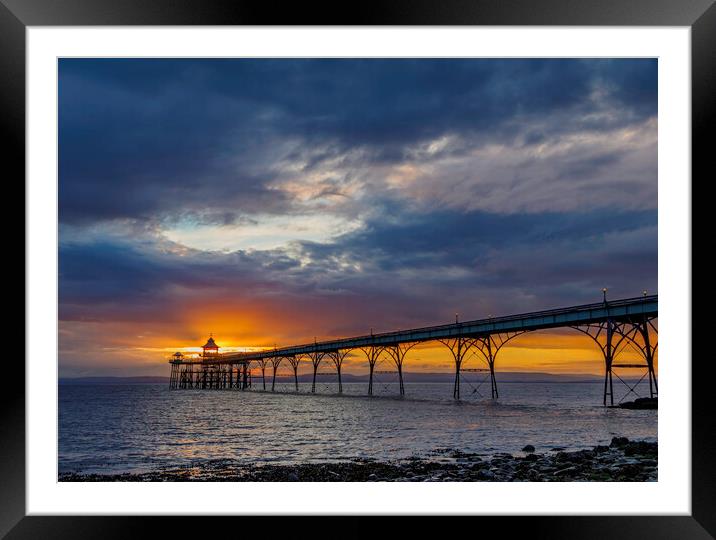 Clevedon Pier at sunset on a cloudy evening Framed Mounted Print by Rory Hailes
