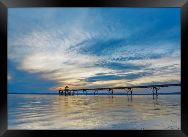 Clevedon Pier on a cloudy evening Framed Print by Rory Hailes