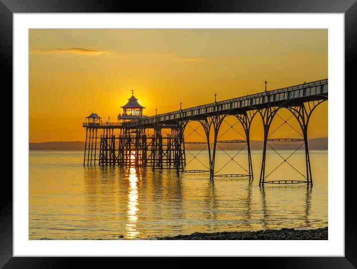 Clevedon Pier with a streak of sunlight Framed Mounted Print by Rory Hailes