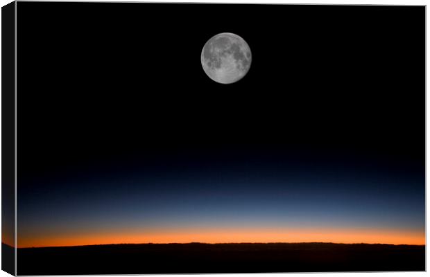 Near full moon against a sunrise from an aircraft Canvas Print by Gordon Dixon