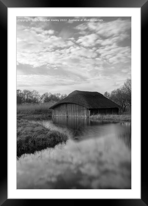Hickling Broad boat house in black and white Framed Mounted Print by Christopher Keeley