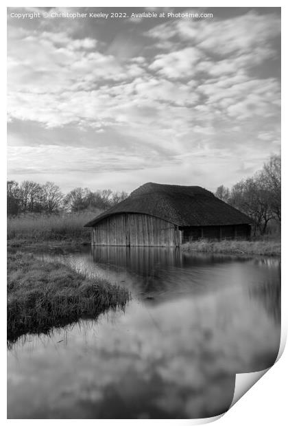 Hickling Broad boat house in black and white Print by Christopher Keeley