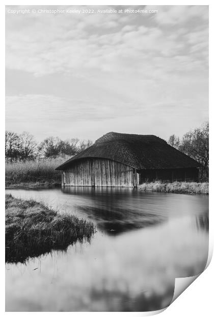 Hickling Broad boat house in monochrome Print by Christopher Keeley