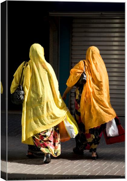 Ladies shopping in Dubai brightly coloured Canvas Print by Gordon Dixon