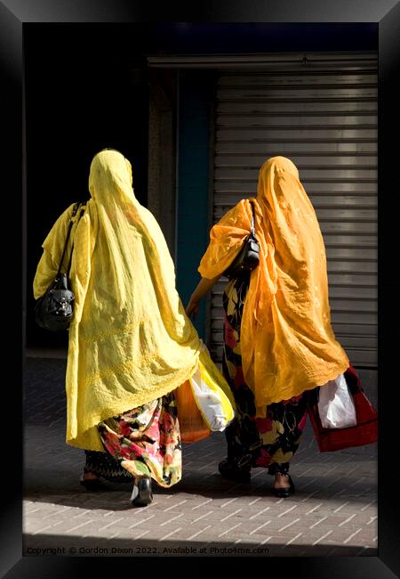 Ladies shopping in Dubai brightly coloured Framed Print by Gordon Dixon