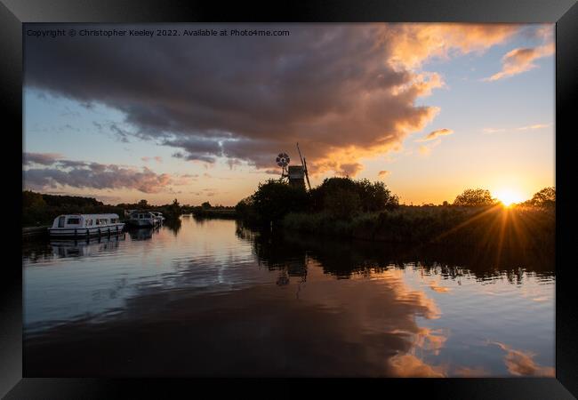 Sunset at Norfolk Broads windmill Framed Print by Christopher Keeley