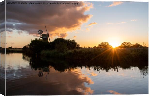 Turf Fen windmill sunset Canvas Print by Christopher Keeley