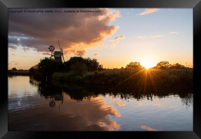 Turf Fen windmill sunset Framed Print by Christopher Keeley