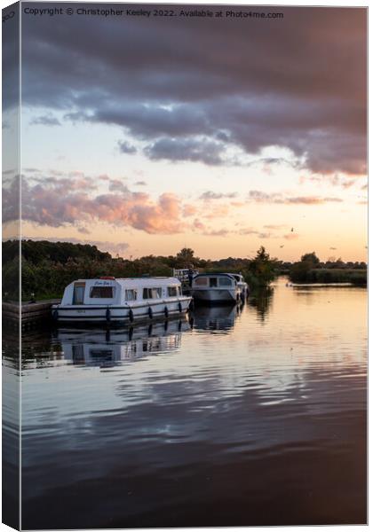 Sunset over Norfolk Broads boats Canvas Print by Christopher Keeley