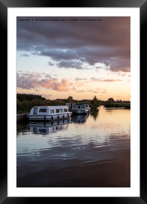Sunset over Norfolk Broads boats Framed Mounted Print by Christopher Keeley