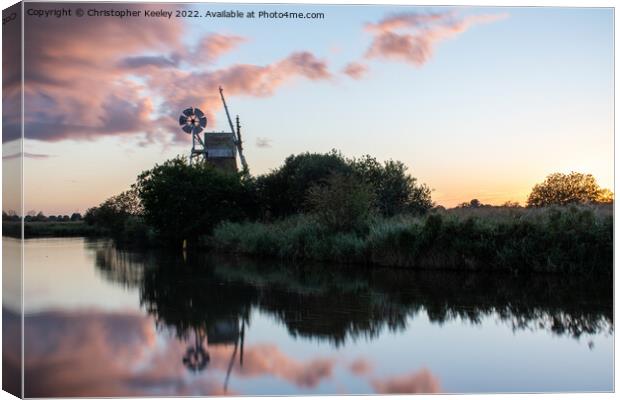 Sunset reflections at How Hill windmill Canvas Print by Christopher Keeley