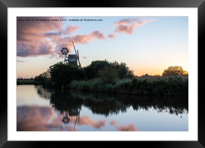 Sunset reflections at How Hill windmill Framed Mounted Print by Christopher Keeley