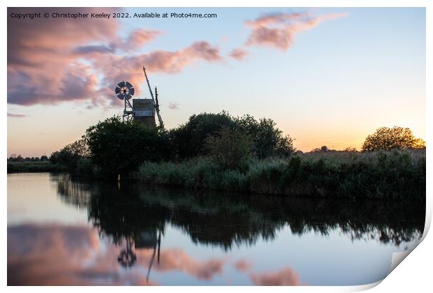 Sunset reflections at How Hill windmill Print by Christopher Keeley