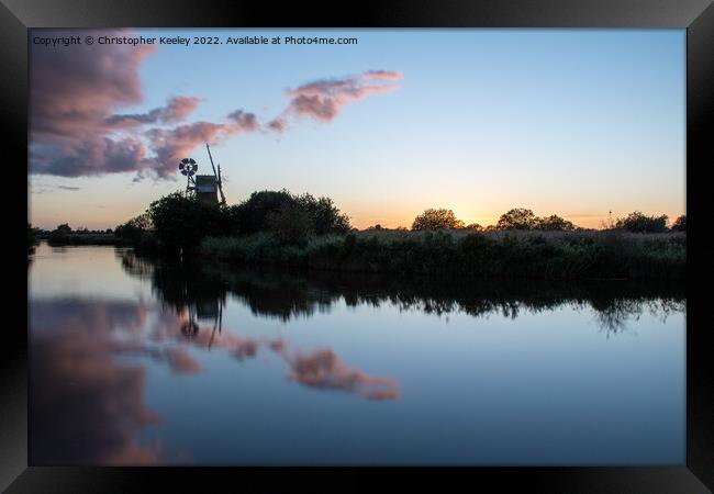 Sunset reflections at Turf Fen windpump Framed Print by Christopher Keeley