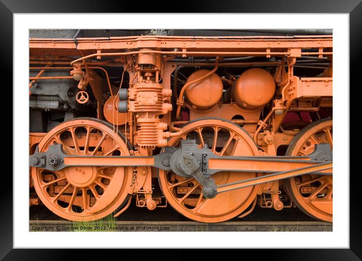 Brightly painted close up of a locomotive Framed Mounted Print by Gordon Dixon
