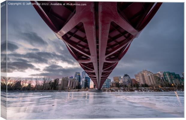 Peace Bridge over frozen Bow River Canvas Print by Jeff Whyte
