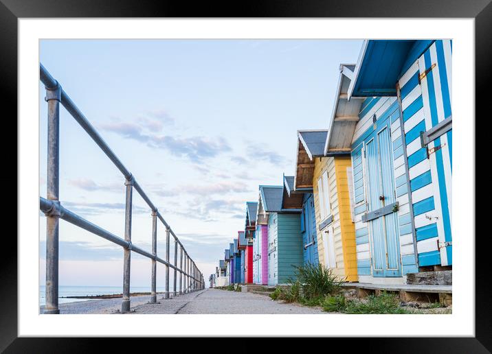 Looking up at the Cromer beach huts Framed Mounted Print by Jason Wells