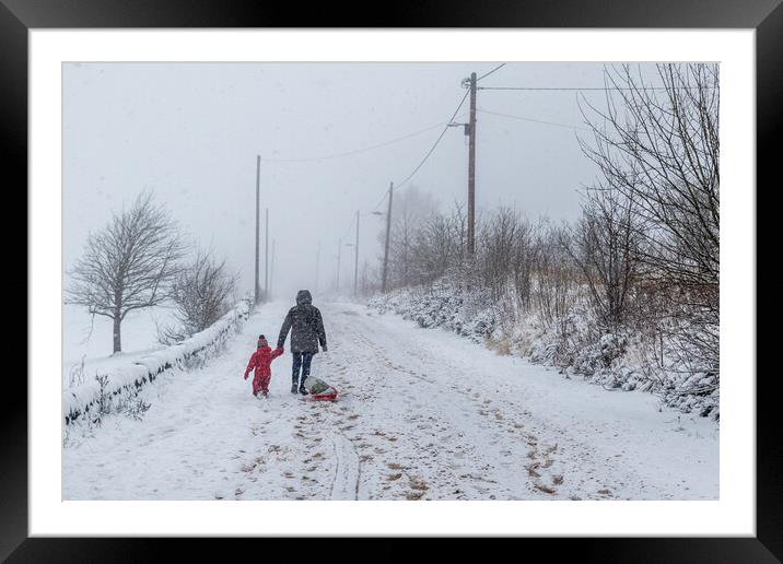 Snow covers the roads Framed Mounted Print by chris smith