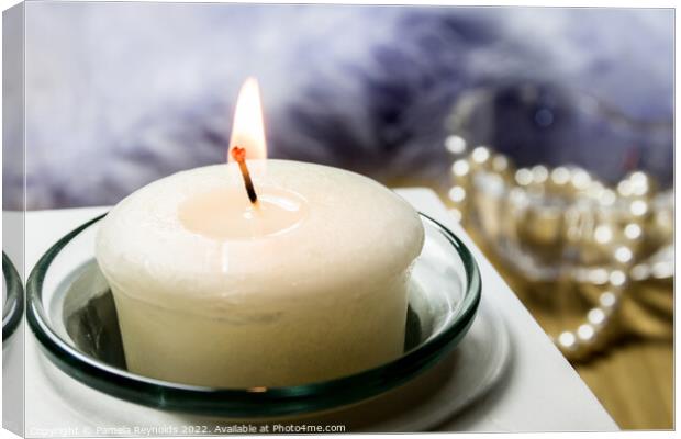 Lit  Candle in a Glass Holder  Canvas Print by Pamela Reynolds