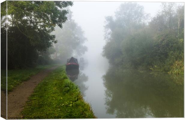 Early morning fog on the canal Canvas Print by Clive Wells