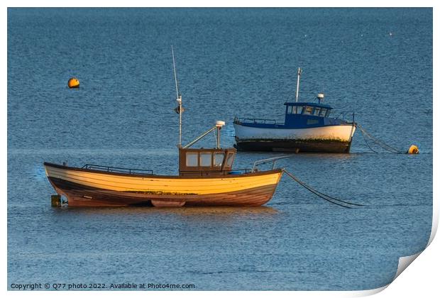 Moored boat illuminated by the rays of the setting sun on the shoal during low tide Print by Q77 photo