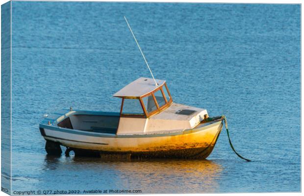 Moored boat illuminated by the rays of the setting sun on the sh Canvas Print by Q77 photo