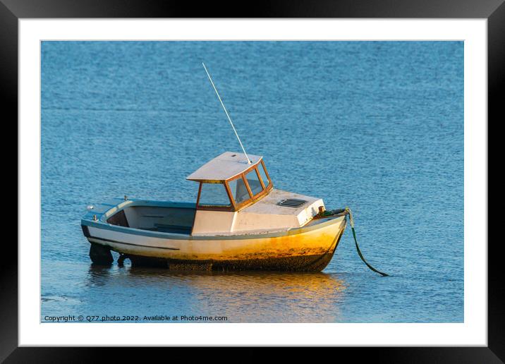 Moored boat illuminated by the rays of the setting sun on the sh Framed Mounted Print by Q77 photo