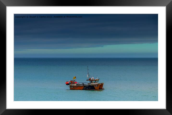 Fishing boat Framed Mounted Print by Stuart C Clarke