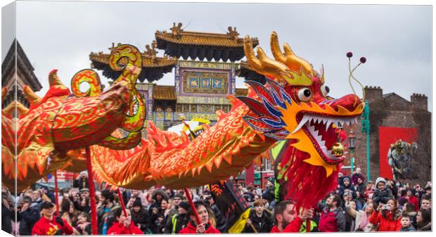 Dragon Dance in front of the arch Canvas Print by Jason Wells