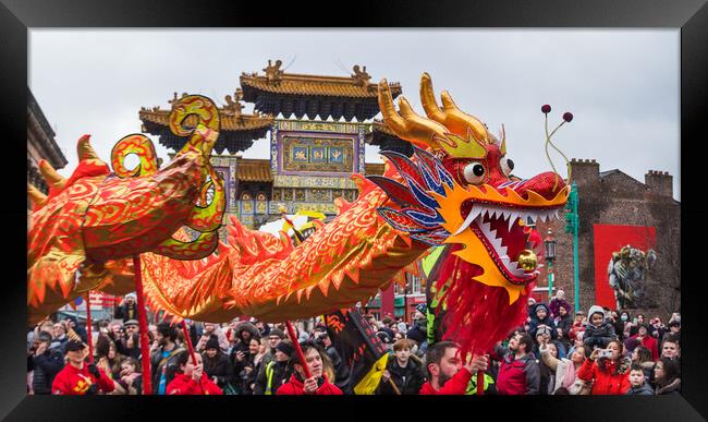 Dragon Dance in front of the arch Framed Print by Jason Wells
