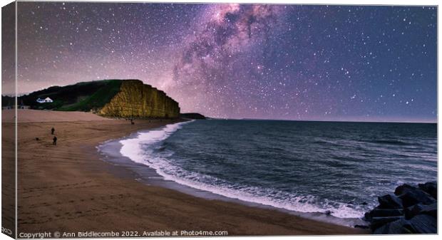West Bay Beach and Cliffs under the milky way  Canvas Print by Ann Biddlecombe
