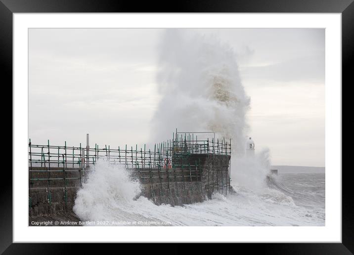 Waves crash over Porthcawl lighthouse Framed Mounted Print by Andrew Bartlett