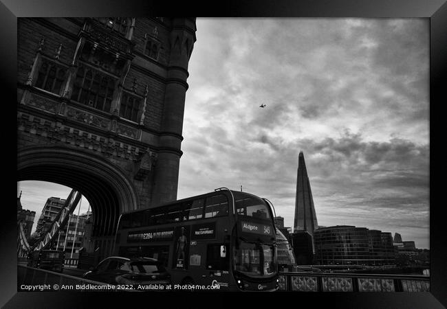 On Tower Bridge as a bus goes past Framed Print by Ann Biddlecombe