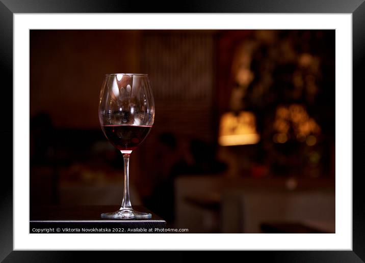 A glass of red wine  Framed Mounted Print by Viktoriia Novokhatska