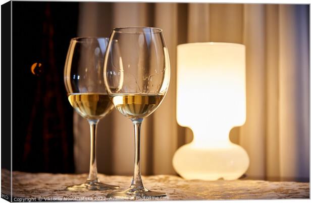 Two glasses of white wine Canvas Print by Viktoriia Novokhatska