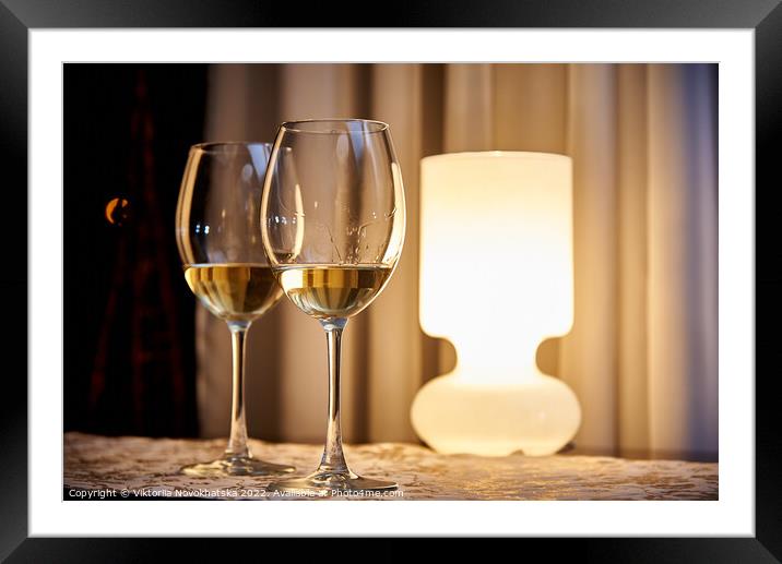 Two glasses of white wine Framed Mounted Print by Viktoriia Novokhatska