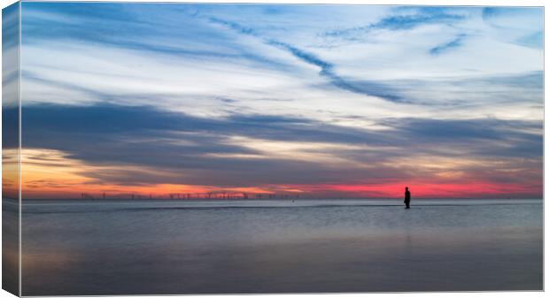 Iron Man in front of a colourful sky Canvas Print by Jason Wells