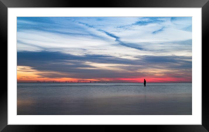 Iron Man in front of a colourful sky Framed Mounted Print by Jason Wells