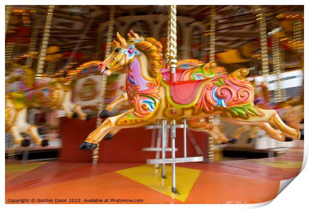 Carousel horses in action at the seaside Print by Gordon Dixon