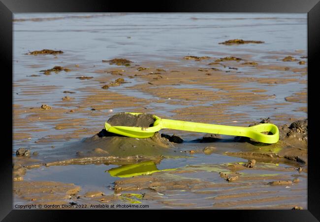 Abandoned yellow spade on Weymouth beach Framed Print by Gordon Dixon